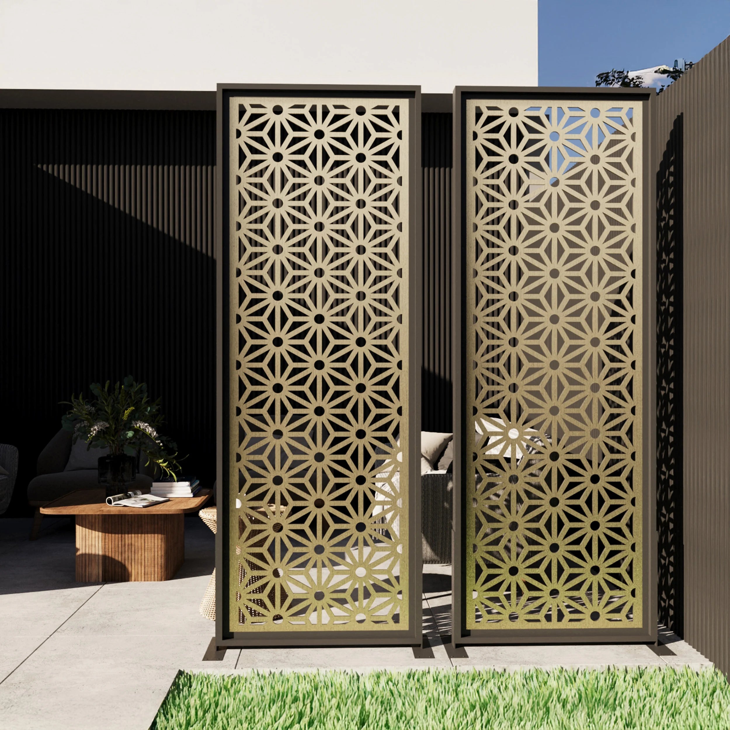 Decorative metal screens with geometric patterns in an outdoor setting.